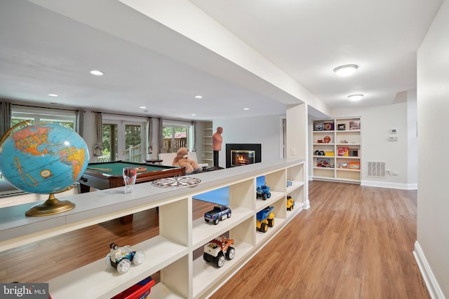 12213 Lake Potomac Ter, Potomac, MD 20854 - hallway with wood finished floors, baseboards, and built in shelves