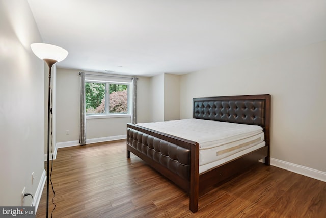 12213 Lake Potomac Ter, Potomac, MD 20854 - bedroom with wood finished floors and baseboards