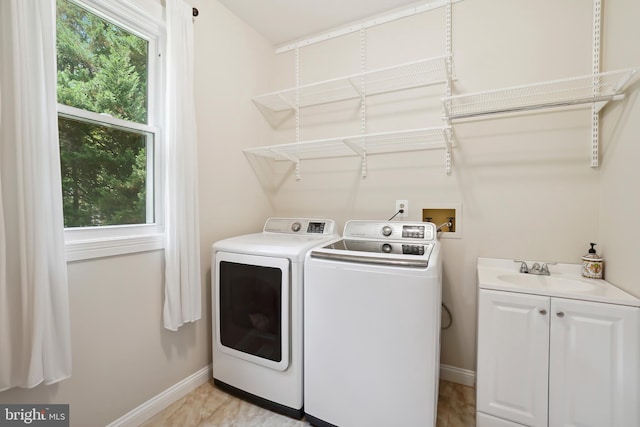 12213 Lake Potomac Ter, Potomac, MD 20854 - laundry area with washing machine and clothes dryer, baseboards, and cabinet space