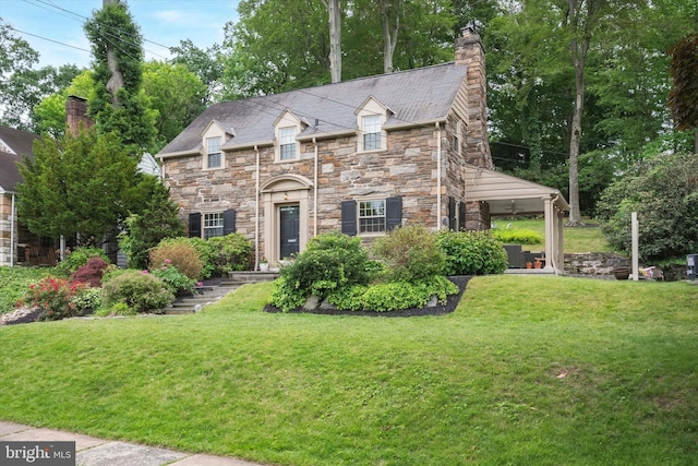 122 Waverly Rd, Wyncote, PA 19095 - view of front of house featuring stone siding, a chimney, and a front lawn