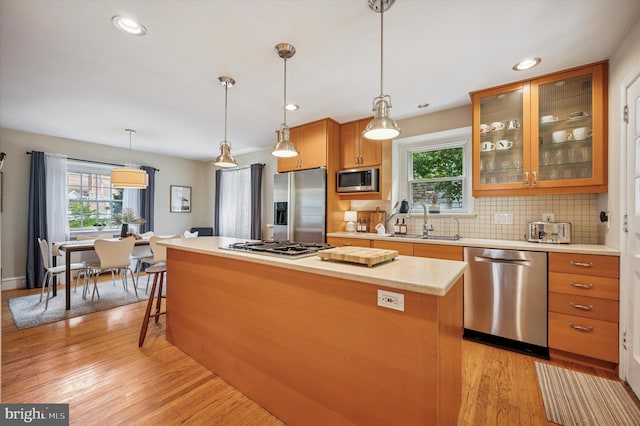 122 Waverly Rd, Wyncote, PA 19095 - kitchen featuring stainless steel appliances, a sink, plenty of natural light, a center island, and recessed lighting