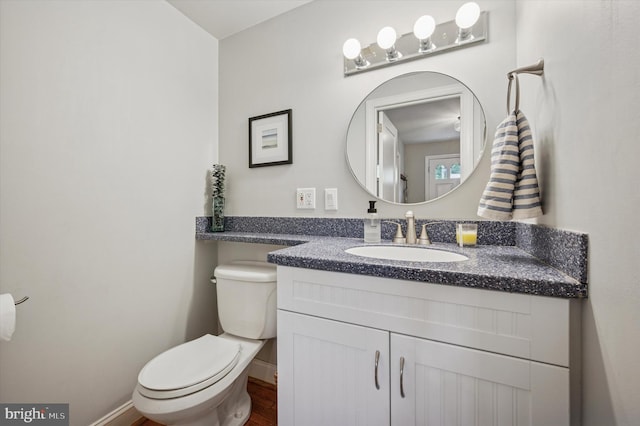 122 Waverly Rd, Wyncote, PA 19095 - bathroom featuring vanity, toilet, wood finished floors, and baseboards