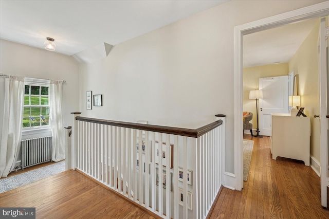 122 Waverly Rd, Wyncote, PA 19095 - hallway featuring radiator, an upstairs landing, and wood finished floors