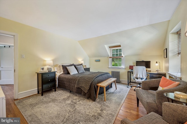 122 Waverly Rd, Wyncote, PA 19095 - bedroom with wood finished floors, radiator heating unit, lofted ceiling, baseboards, and an office area