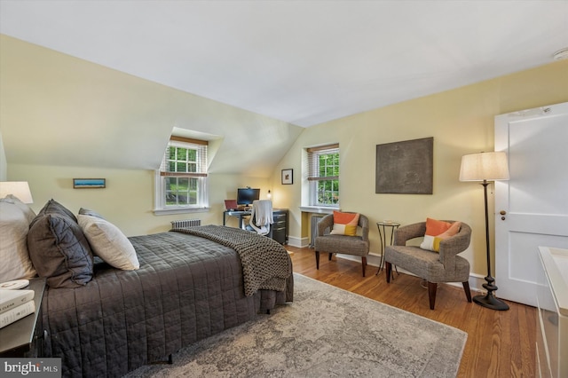 122 Waverly Rd, Wyncote, PA 19095 - bedroom featuring radiator heating unit, wood finished floors, lofted ceiling, baseboards, and an office area