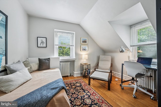 122 Waverly Rd, Wyncote, PA 19095 - bedroom with radiator, vaulted ceiling, wood finished floors, and baseboards