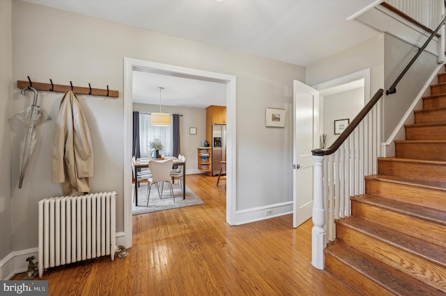 122 Waverly Rd, Wyncote, PA 19095 - entryway featuring radiator heating unit, light wood-type flooring, baseboards, and stairway