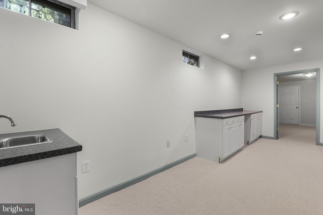 13423 Rippling Brook Dr, Silver Spring, MD 20906 - kitchen featuring a sink, recessed lighting, light colored carpet, baseboards, and dark countertops