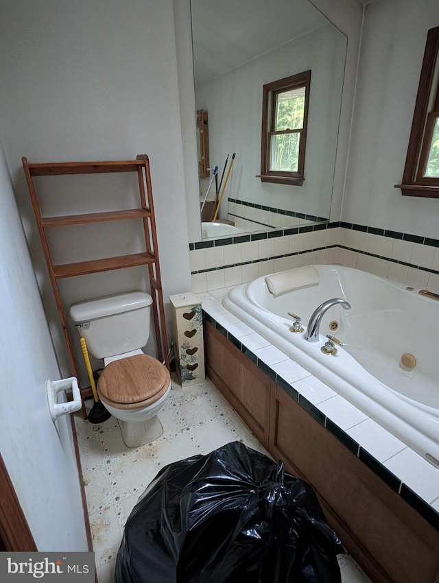 42 Beaver Ave, Enola, PA 17025 - full bathroom with a tub with jets, toilet, and plenty of natural light
