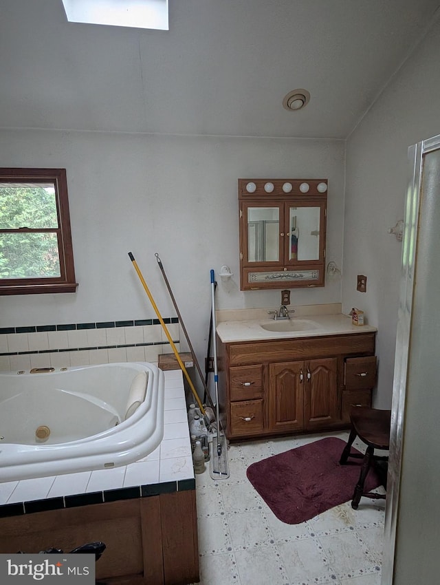42 Beaver Ave, Enola, PA 17025 - bathroom featuring vanity, a whirlpool tub, and a skylight