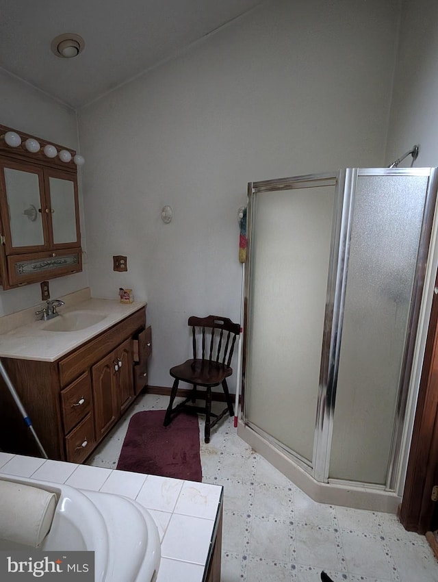 42 Beaver Ave, Enola, PA 17025 - bathroom with vanity, a stall shower, tile patterned floors, and baseboards