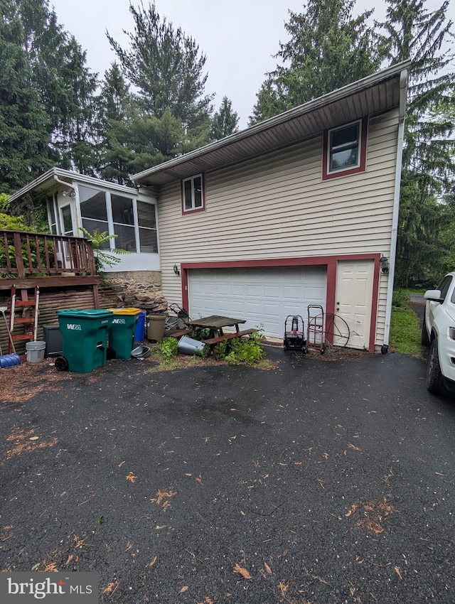 42 Beaver Ave, Enola, PA 17025 - view of home's exterior with a sunroom, an attached garage, and driveway