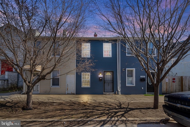 3559 4th St, Baltimore, MD 21225 - townhome / multi-family property with a chimney