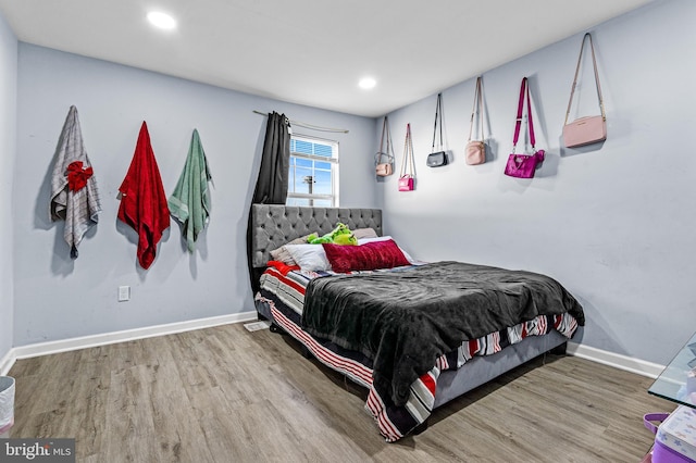 3559 4th St, Baltimore, MD 21225 - bedroom with wood finished floors, baseboards, and recessed lighting