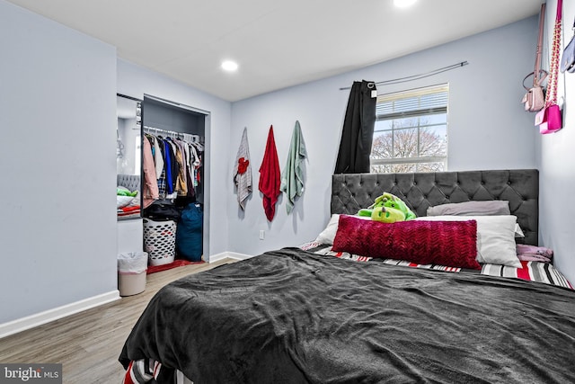 3559 4th St, Baltimore, MD 21225 - bedroom with wood finished floors, baseboards, and recessed lighting