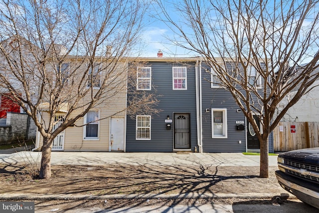 3559 4th St, Baltimore, MD 21225 - view of front of property featuring a chimney