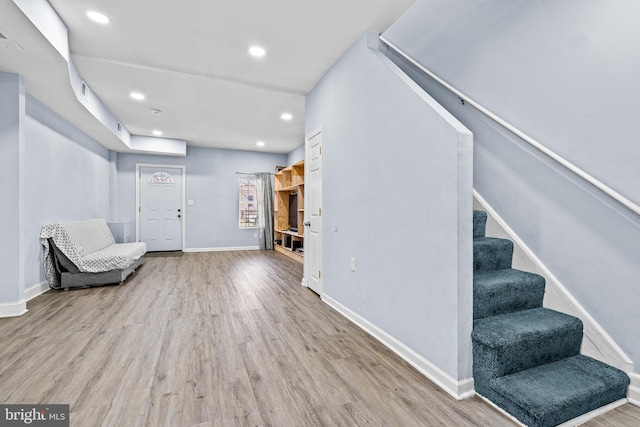 3559 4th St, Baltimore, MD 21225 - living area with wood finished floors, stairway, recessed lighting, and baseboards