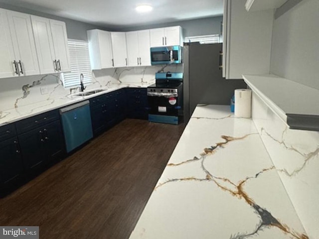 11778 Old Skipton Rd, Cordova, MD 21625 - kitchen featuring stainless steel appliances, light stone countertops, dark wood-type flooring, white cabinets, and dark cabinetry