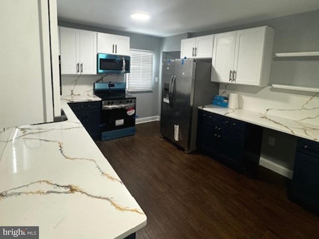 11778 Old Skipton Rd, Cordova, MD 21625 - kitchen with stainless steel appliances, open shelves, light stone counters, white cabinetry, and dark wood finished floors