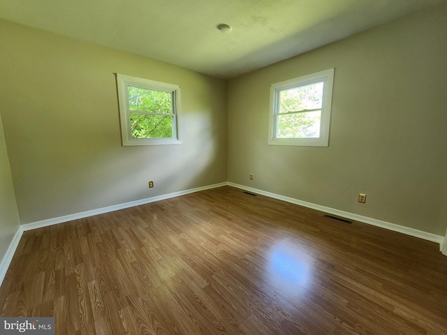 1983 Nault Rd, Dover, DE 19904 - unfurnished room featuring healthy amount of natural light, wood finished floors, and baseboards