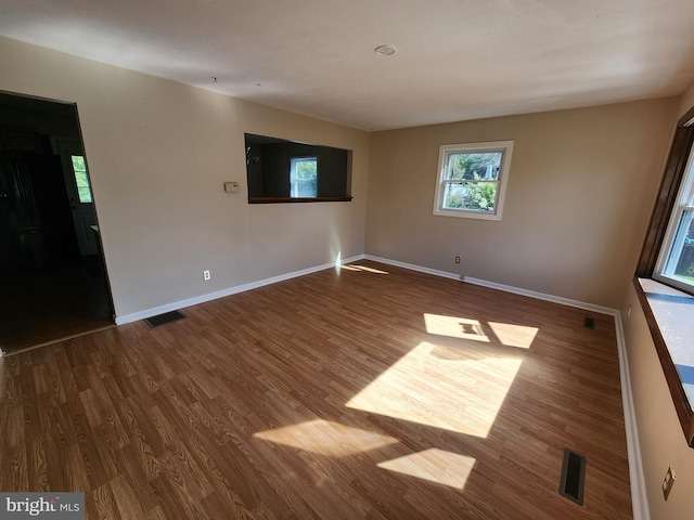 1983 Nault Rd, Dover, DE 19904 - empty room with wood finished floors and baseboards