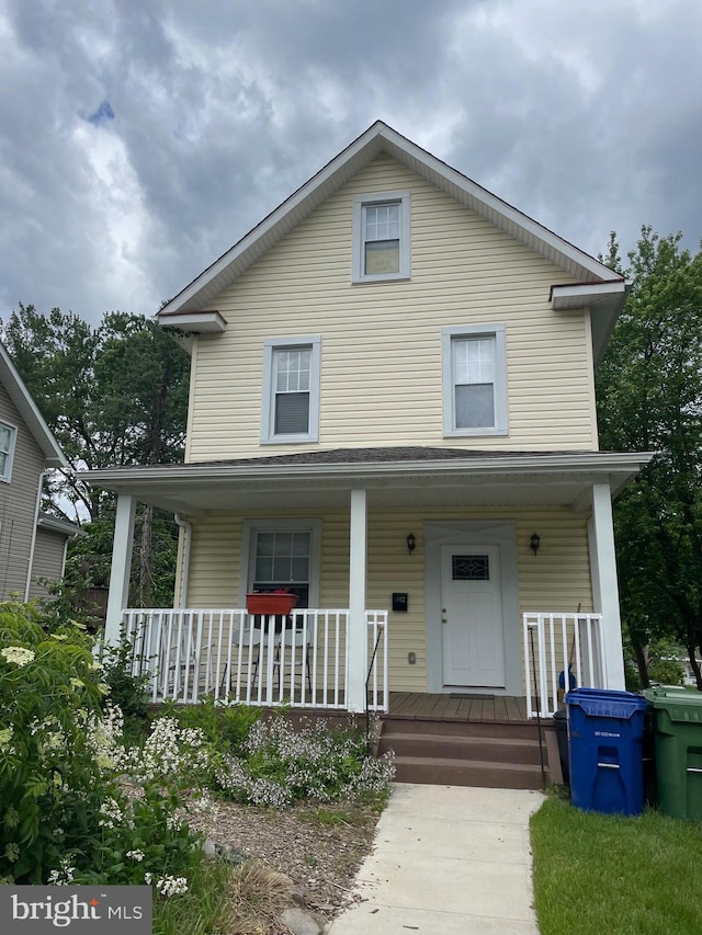 5012 Catalpha Rd, Baltimore, MD 21214 - view of front facade featuring a porch