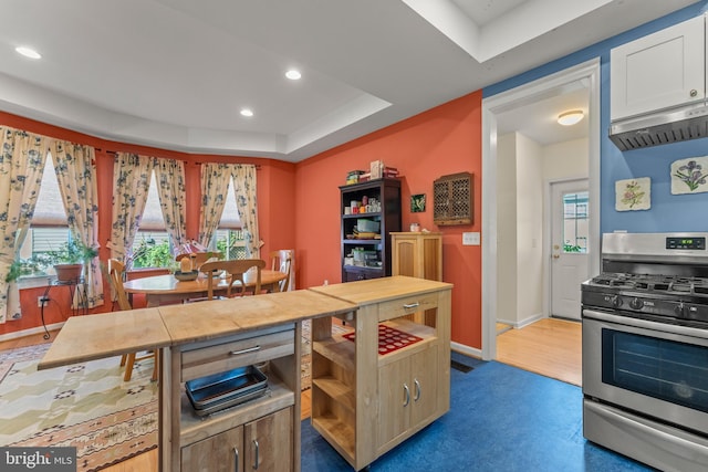 5012 Catalpha Rd, Baltimore, MD 21214 - kitchen featuring stainless steel range with gas stovetop, range hood, recessed lighting, white cabinets, and a tray ceiling