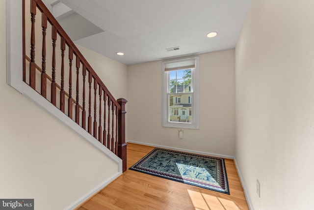 5012 Catalpha Rd, Baltimore, MD 21214 - entryway with wood finished floors, stairs, and recessed lighting