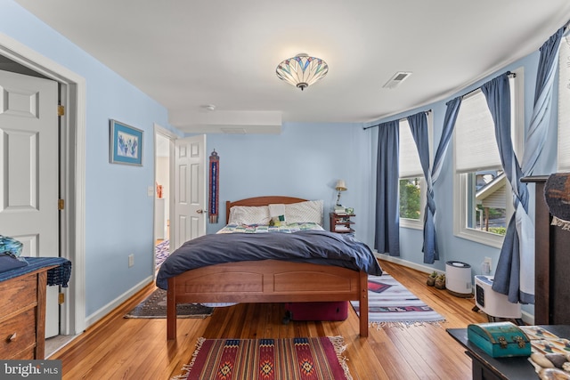 5012 Catalpha Rd, Baltimore, MD 21214 - bedroom featuring hardwood / wood-style floors and baseboards
