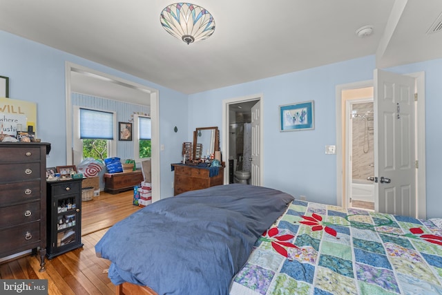 5012 Catalpha Rd, Baltimore, MD 21214 - bedroom with wood finished floors and ensuite bathroom