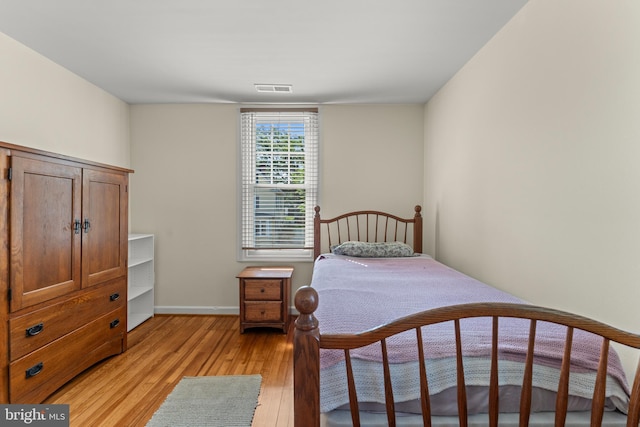 5012 Catalpha Rd, Baltimore, MD 21214 - bedroom with light wood-style flooring and baseboards