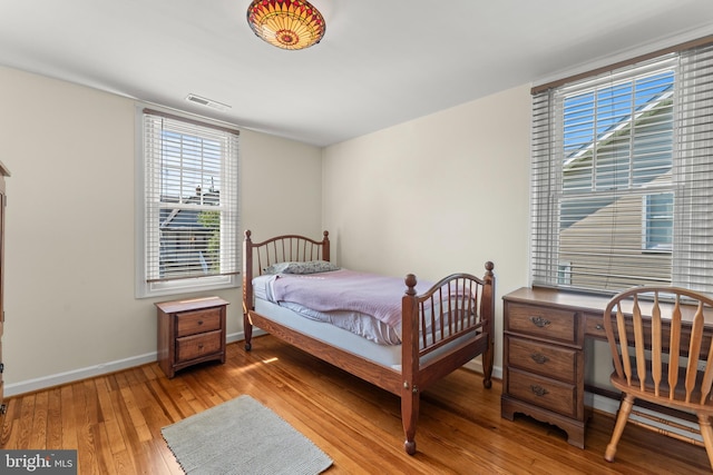 5012 Catalpha Rd, Baltimore, MD 21214 - bedroom featuring light wood-style flooring and an office area