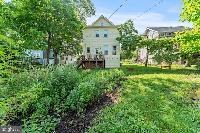 5012 Catalpha Rd, Baltimore, MD 21214 - rear view of property featuring a wooden deck and stairway
