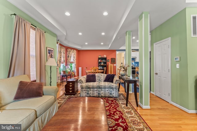 5012 Catalpha Rd, Baltimore, MD 21214 - living area featuring light wood finished floors, recessed lighting, and a raised ceiling