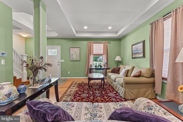 5012 Catalpha Rd, Baltimore, MD 21214 - living area with wood finished floors, stairway, recessed lighting, and a raised ceiling