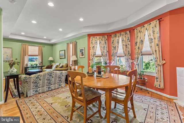 5012 Catalpha Rd, Baltimore, MD 21214 - dining area with wood finished floors, a tray ceiling, and recessed lighting