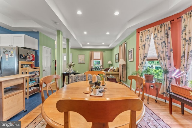 5012 Catalpha Rd, Baltimore, MD 21214 - dining area with light wood-style flooring, recessed lighting, and a tray ceiling