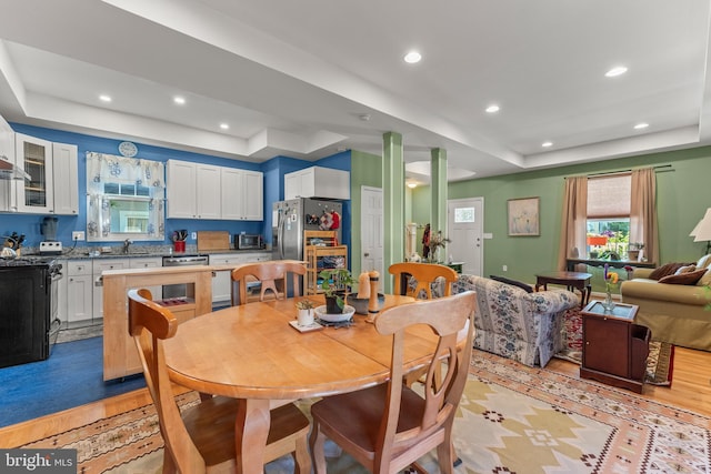 5012 Catalpha Rd, Baltimore, MD 21214 - dining area with a raised ceiling, light wood-type flooring, and recessed lighting