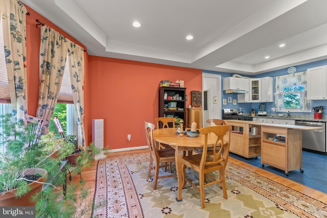 5012 Catalpha Rd, Baltimore, MD 21214 - dining area featuring a tray ceiling, plenty of natural light, light wood finished floors, and recessed lighting