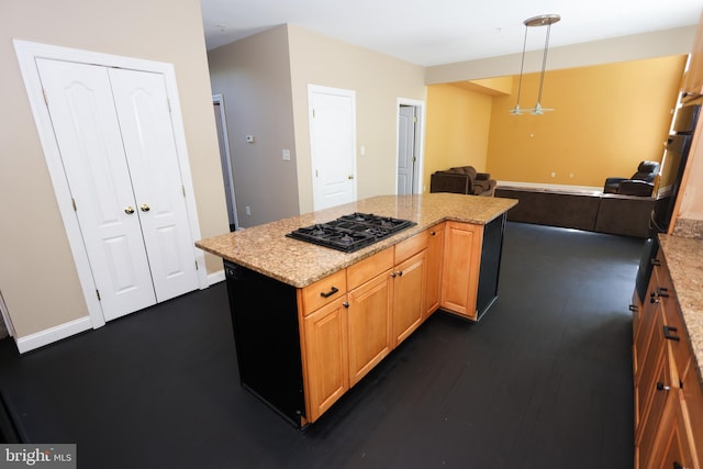 14714 Mount Calvert Rd, Upper Marlboro, MD 20772 - kitchen featuring black gas stovetop, open floor plan, a kitchen island, light stone countertops, and decorative light fixtures