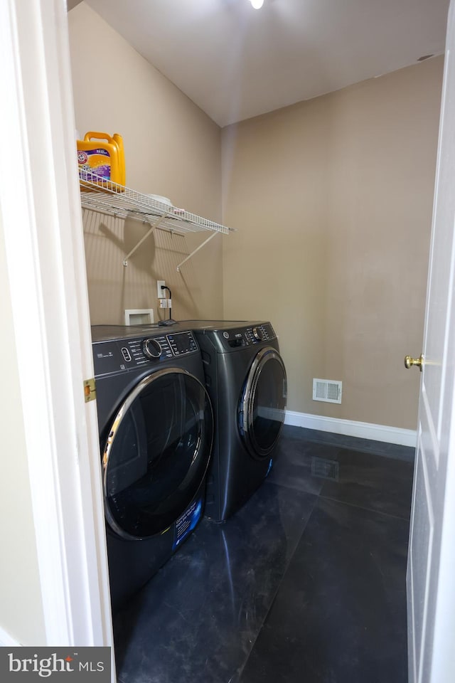 14714 Mount Calvert Rd, Upper Marlboro, MD 20772 - washroom featuring washing machine and clothes dryer and baseboards