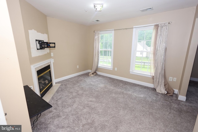 14714 Mount Calvert Rd, Upper Marlboro, MD 20772 - unfurnished living room featuring a fireplace with flush hearth, carpet floors, and baseboards