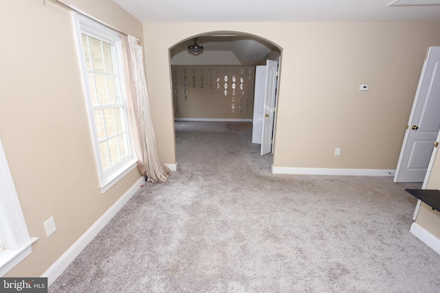 14714 Mount Calvert Rd, Upper Marlboro, MD 20772 - empty room with carpet flooring, arched walkways, and baseboards