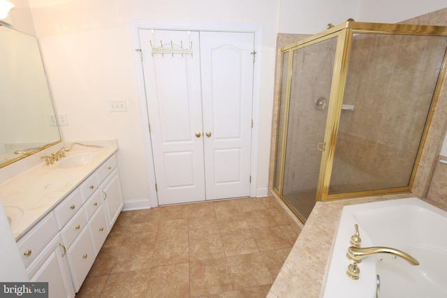 14714 Mount Calvert Rd, Upper Marlboro, MD 20772 - full bath with double vanity, a shower stall, a garden tub, and baseboards