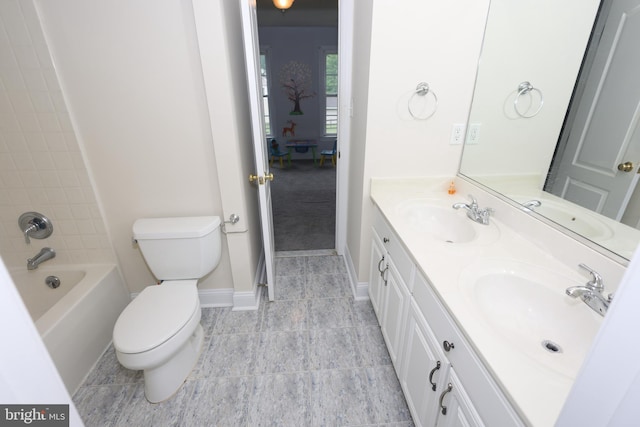 14714 Mount Calvert Rd, Upper Marlboro, MD 20772 - bathroom with double vanity, toilet, baseboards, and tub / shower combination