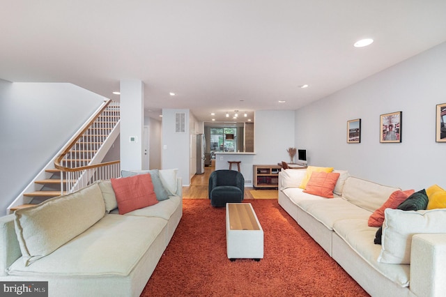 1690 Chimney House Rd, Reston, VA 20190 - living room with recessed lighting, stairway, and wood finished floors