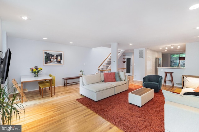 1690 Chimney House Rd, Reston, VA 20190 - living area featuring light wood finished floors, stairs, and recessed lighting