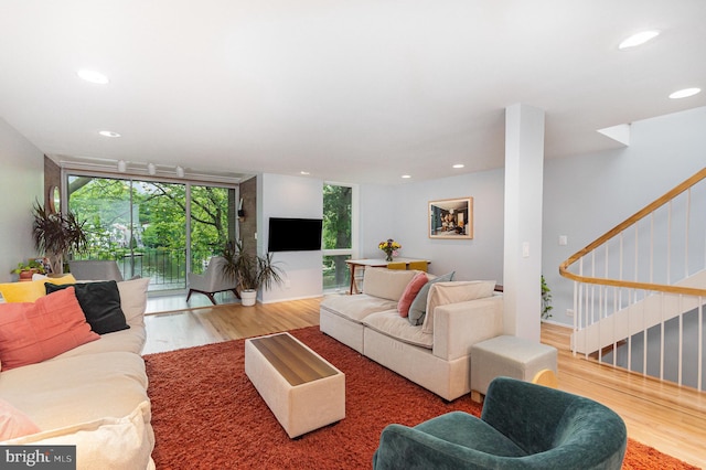 1690 Chimney House Rd, Reston, VA 20190 - living room featuring wood finished floors, floor to ceiling windows, recessed lighting, and stairway