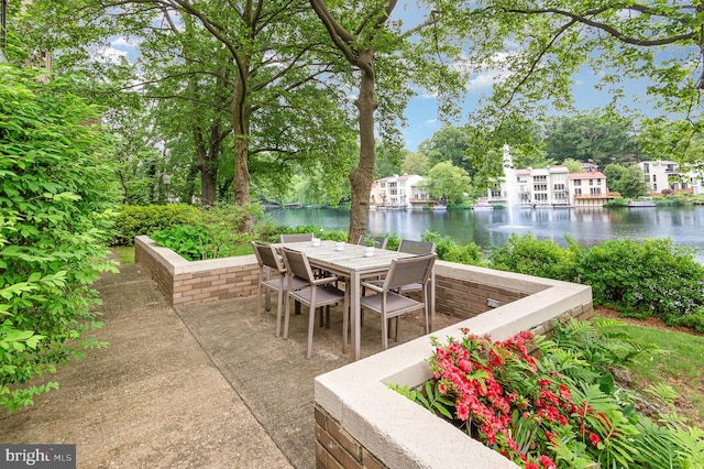 1690 Chimney House Rd, Reston, VA 20190 - view of patio with a water view, outdoor dining area, and view of wooded area