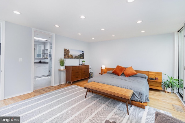1690 Chimney House Rd, Reston, VA 20190 - bedroom featuring light wood finished floors, recessed lighting, and connected bathroom